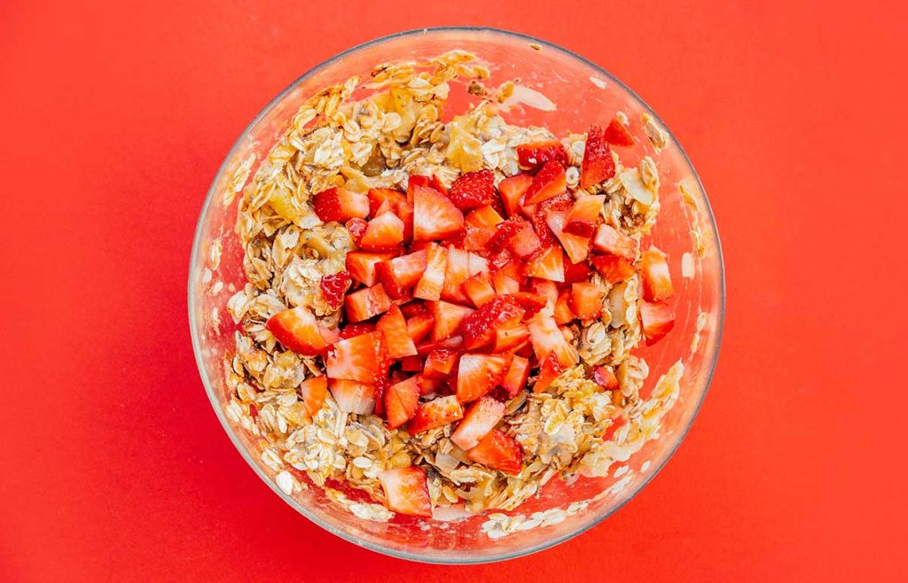 Adding strawberries to healthy cookie dough