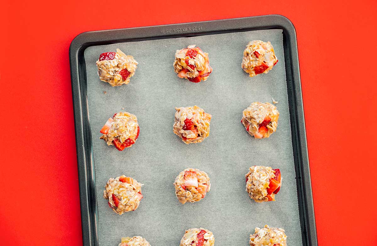 Oat and strawberry cookies on a baking sheet