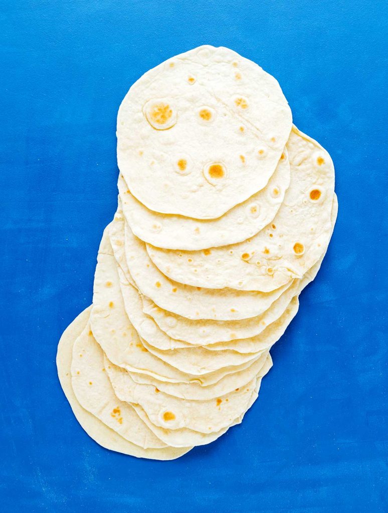 Flour tortillas on a blue background