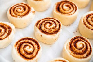 Raw cut cinnamon rolls on marble