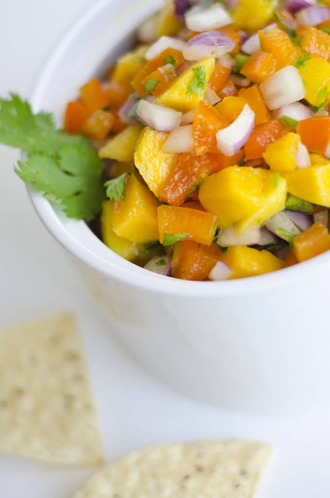 This Mango Salsa is a delightfully refreshing salsa that's balanced with sweet mango, zingy onions, and spicy jalapeno. Serve it as a unique chip dip, taco topper, or salad sprucer-upper!