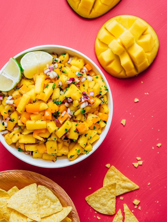 Fresh mango salsa recipe in a bowl with chips