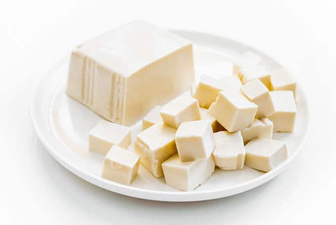 Photo of silken tofu cubed on white background