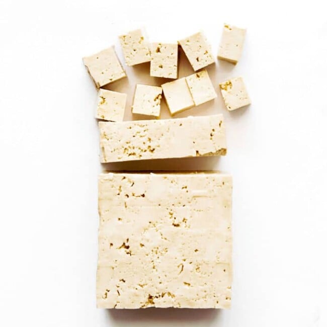 Photo of firm tofu on white background