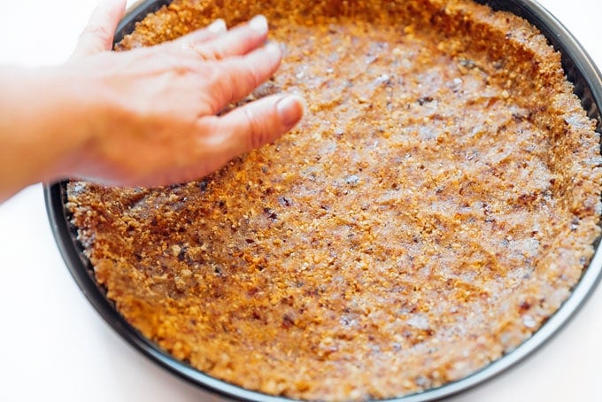 Pressing vegan pie crust into pan
