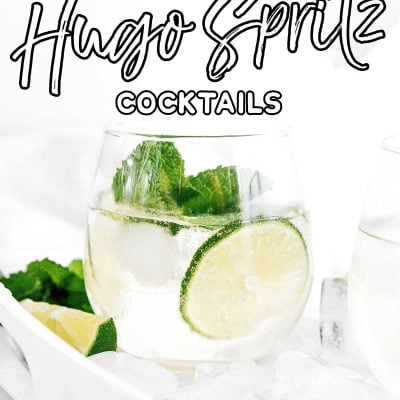 Hugo spritz cocktail in a glass with lime and mint