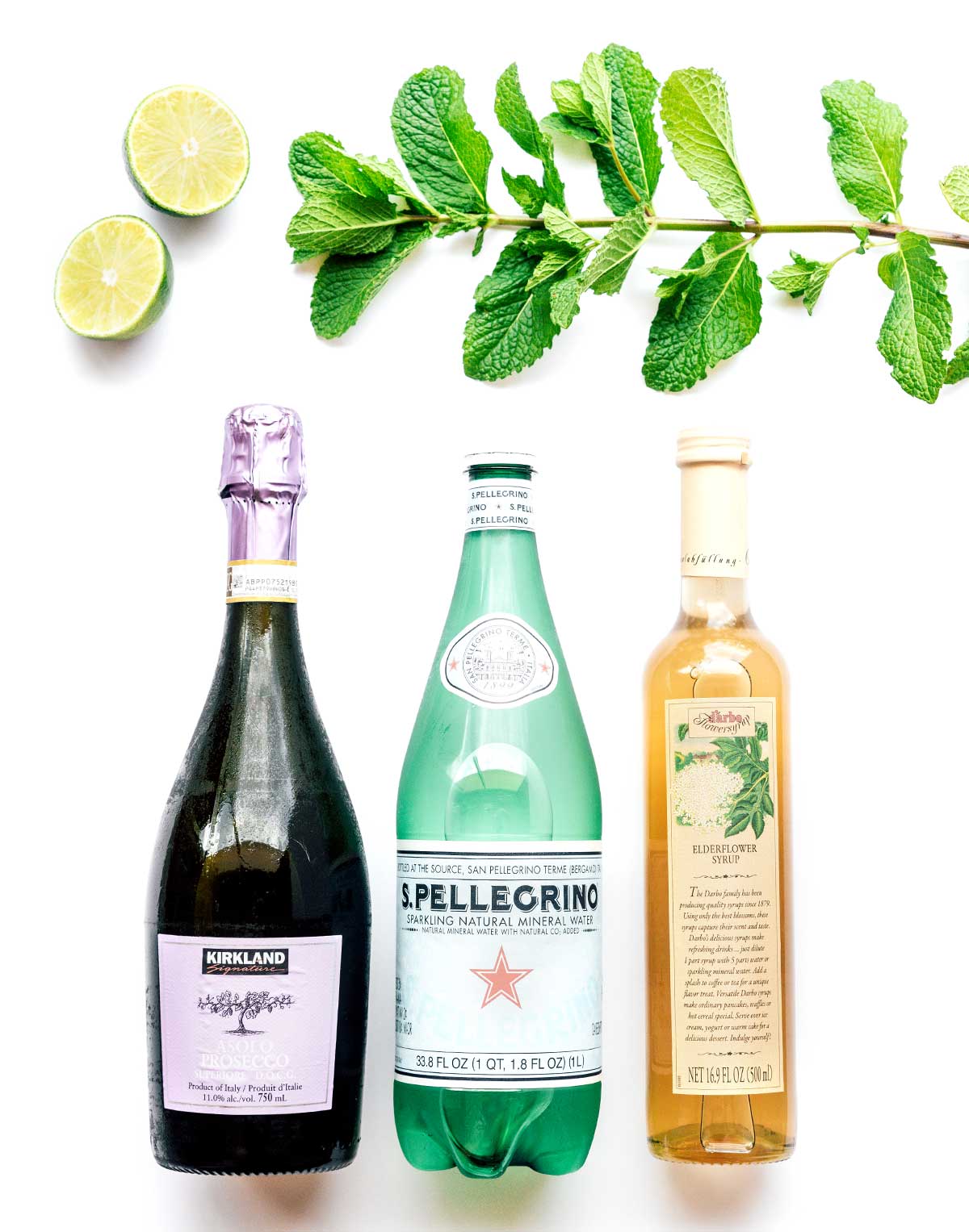 Prosecco, sparkling water, elderflower syrup, lime, and mint for making homemade hugo cocktails