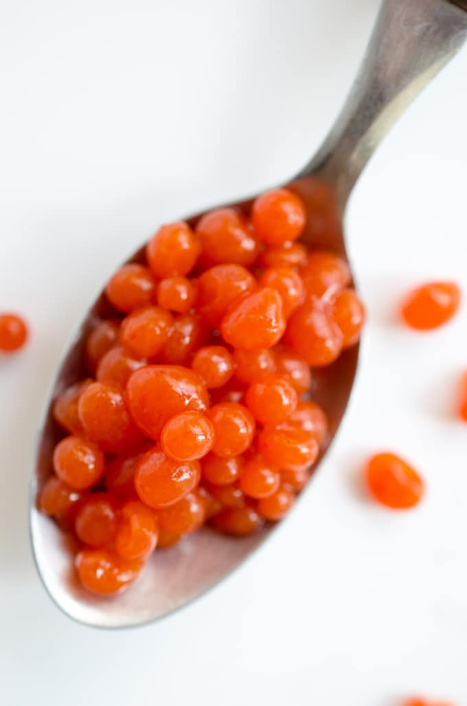 This Sriracha Spherification Caviar is a fun and simple way to use molecular gastronomy to spruce up your cooking! Perfect for sprinkling over salads, eggs, or pasta.