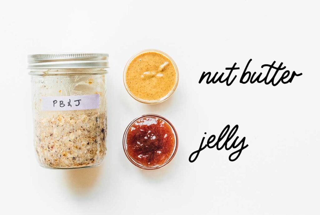 A jar of pb&j overnight oats laid out next to next butter and jelly