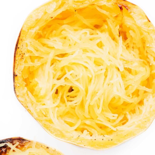 Cooked spaghetti squash on a white background