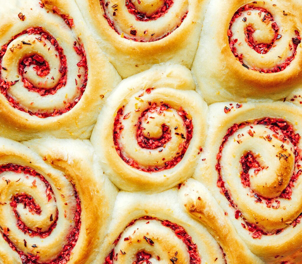 A close up image detailing the texture of cranberry cinnamon rolls