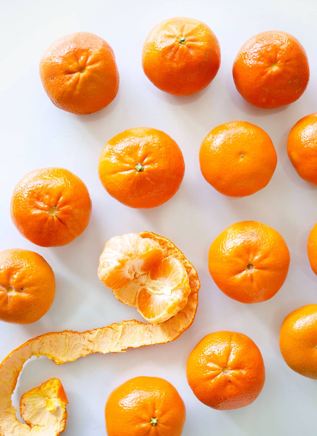 Many oranges on a gray background.