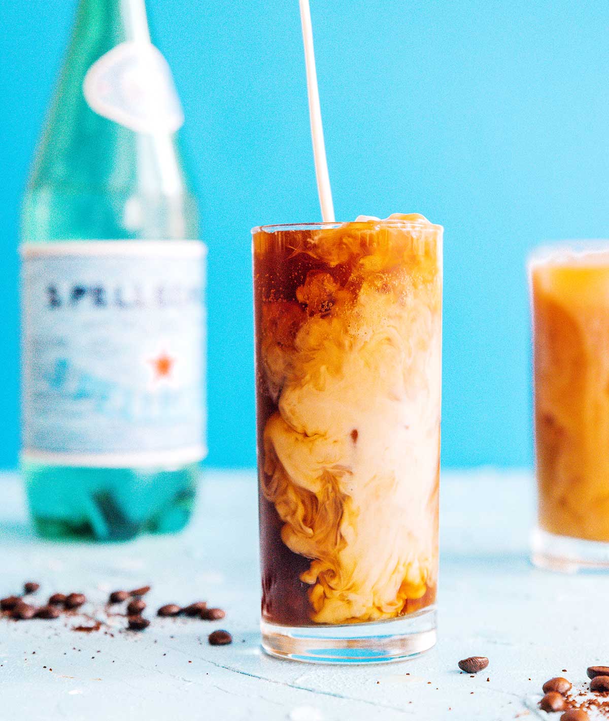 Fizzy cold brew coffee with cream in a glass