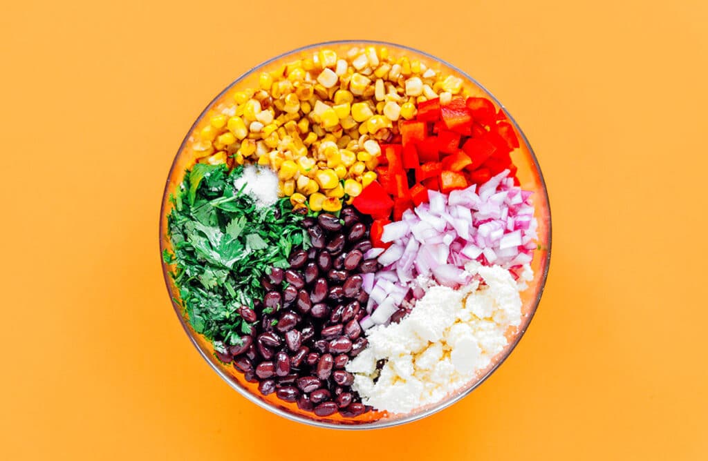 Ingredients for Mexican corn salad in a bowl