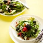A refreshing summer berry salad packed with fresh berried and goat cheese, and drizzled with a lavender lemon vinaigrette!
