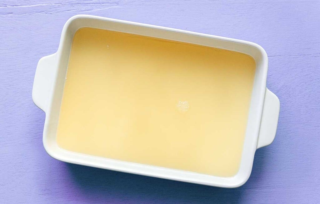 A casserole dish filled with lavender lemonade