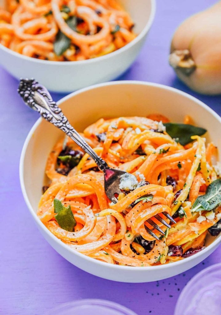 Butternut squash noodles in a bowl with a fork