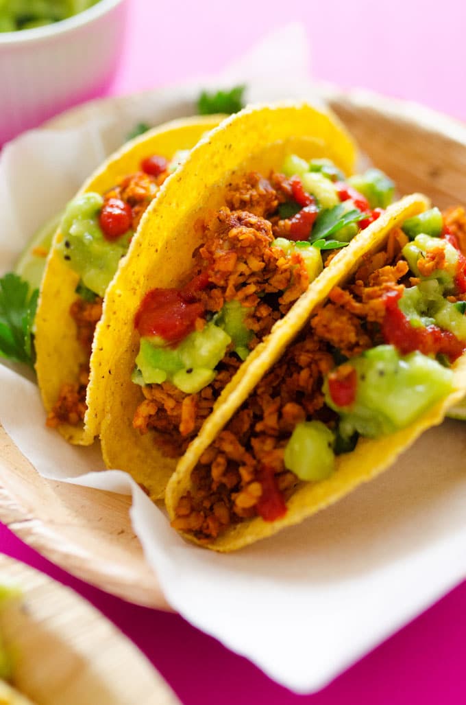 This Tempeh Tacos recipe tastes just like meat, and with Avocado Kiwi Salsa, it's a refreshingly unique and delicious meal you're going to love.