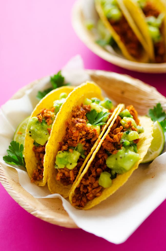 This Tempeh Tacos recipe tastes just like meat, and with Avocado Kiwi Salsa, it's a refreshingly unique and delicious meal you're going to love.
