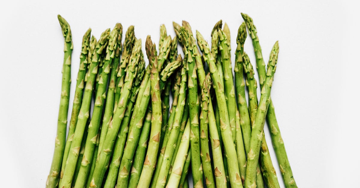 Many asparagus on a white background.