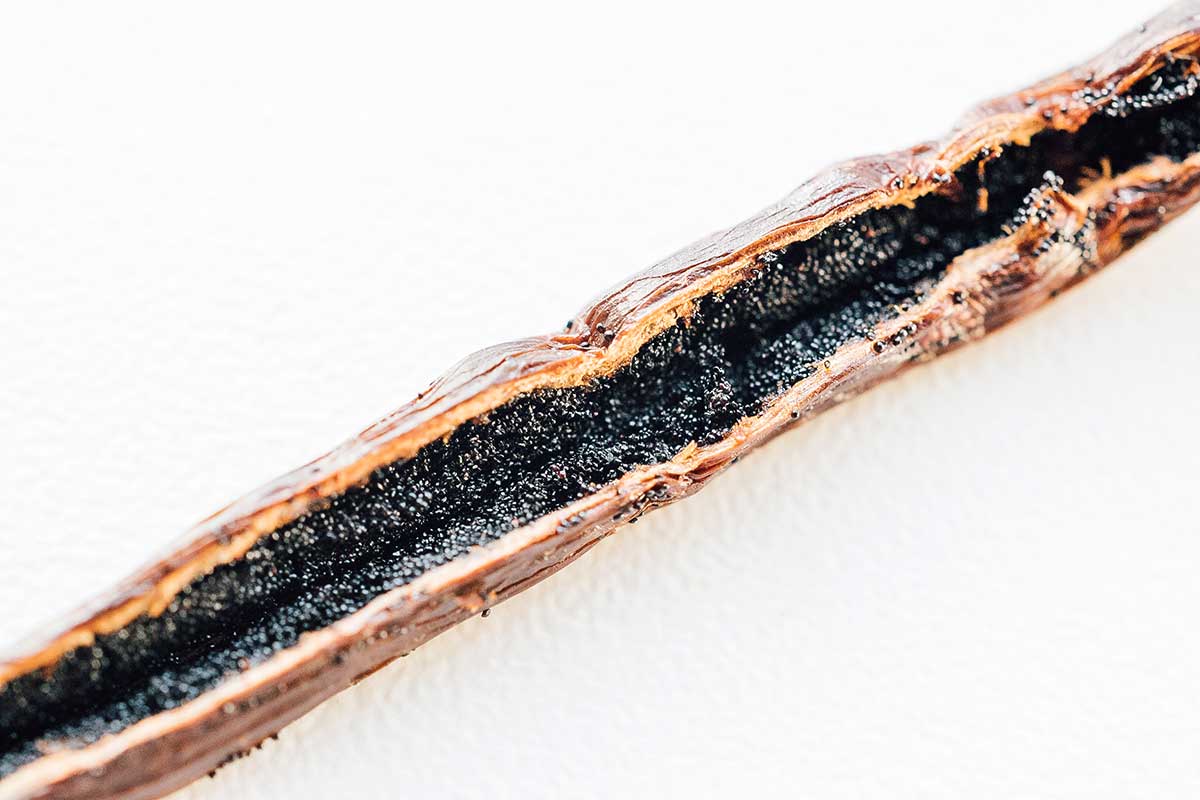 Close up macro photo of vanilla seeds in vanilla pod