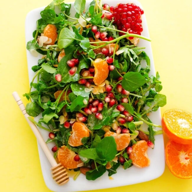 This Citrus Watercress Salad is a simple, summery combination of clementines, pomegranate, and leafy greens, tossed in a cinnamon yogurt dressing.