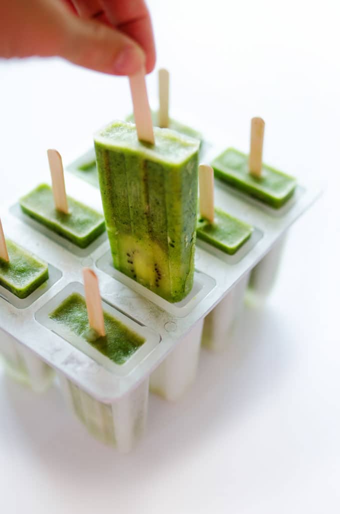 These healthy Green Smoothie Popsicles, with ginger, fruit, and spinach, are a fun and refreshing treat for summer.