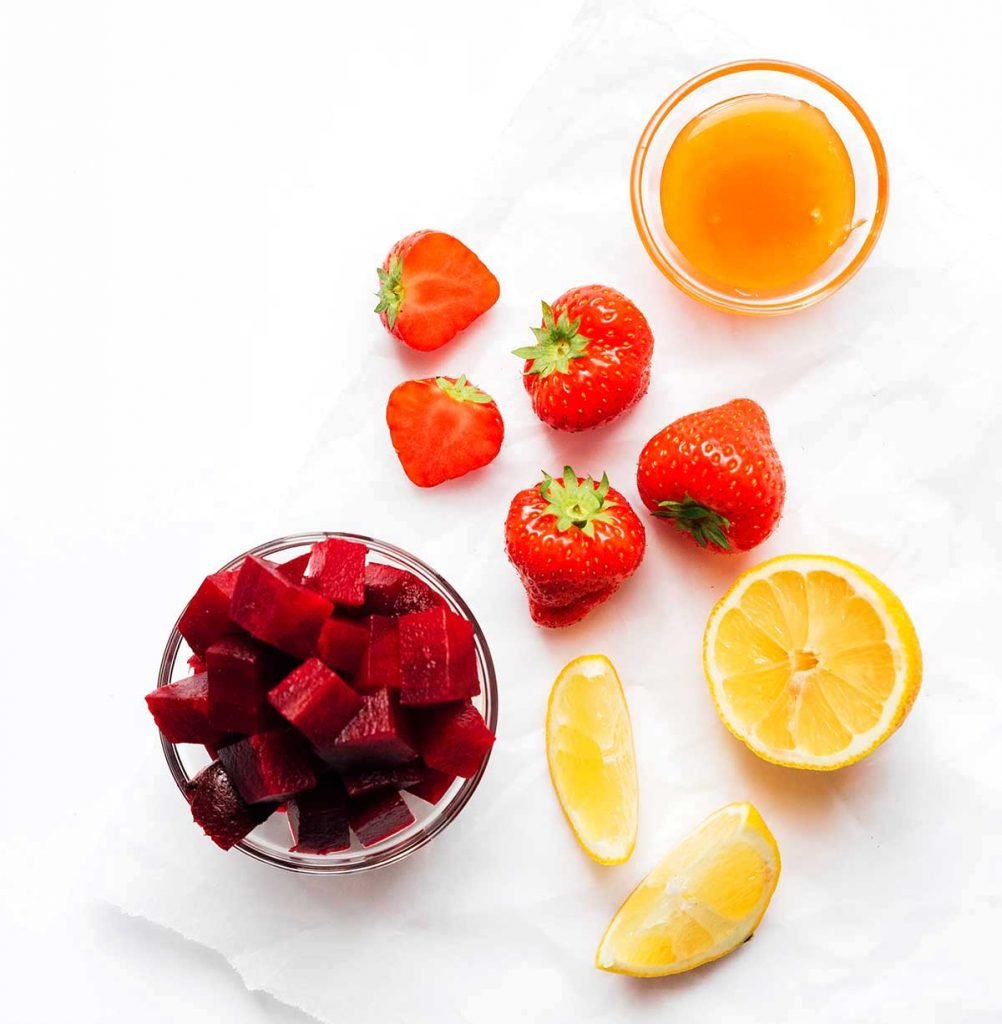Red fruit and veggies on a white background
