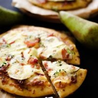 This Gorgonzola Pear Pizza is loaded with autumn flavor...caramelized onions, thyme, brie, the works!