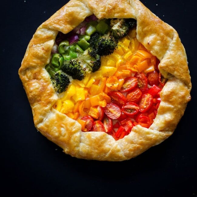 Getting your serving of veggies is easy with this Rainbow Vegetable Tart. Delicious roasted veggies atop a ricotta parmesan base, wrapped in warm and flaky puff pastry.
