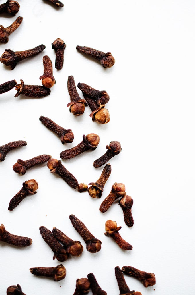 Close up photo of cloves on a white background