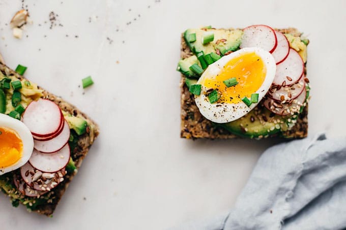 open faced sandwich with boiled egg, avocado, and radish - These radish recipes are simple and delicious (and best of all, they'll make you actually WANT to eat your veggies!) Give them a try for a colorfully peppery crunch.