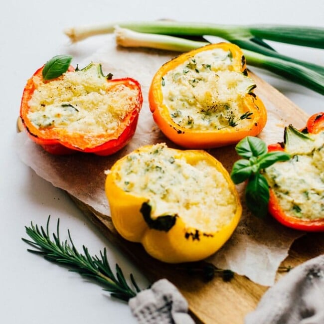 These Herby Ricotta Stuffed Peppers taste straight out of Tuscany with fresh herbs, creamy ricotta, and sharp parmesan.