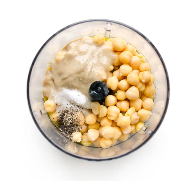 Chickpeas and tahini in a food processor for homemade hummus