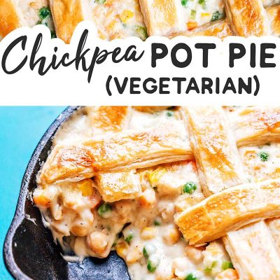 Chickpea pot pie in a cast iron skillet on a blue background