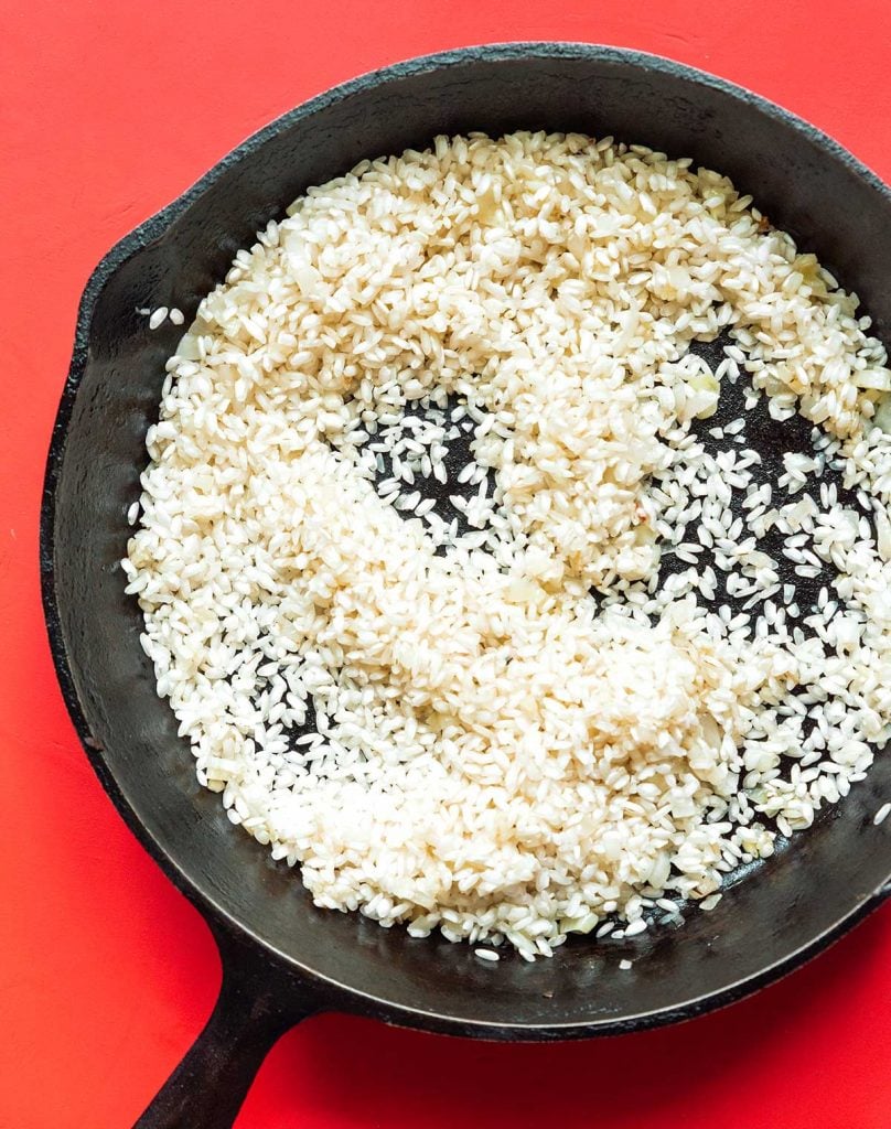 A cast iron skillet filled with Arborio rice