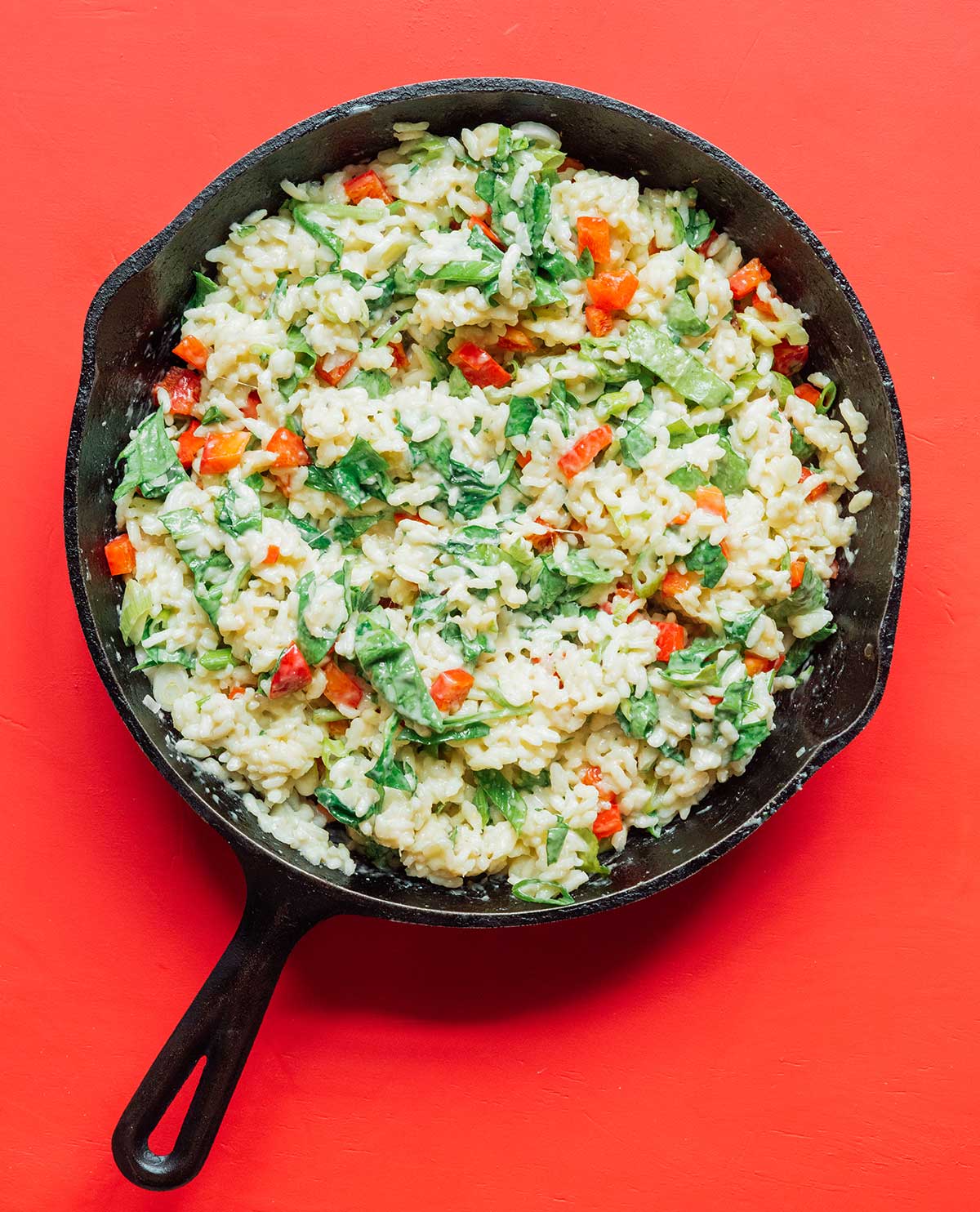 A cast iron skillet filled with cooked gorgonzola pepper risotto