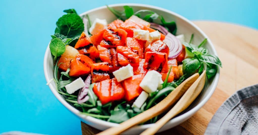 This savory Grilled Watermelon Salad is packed with feta cheese, mint, basil, and onion, and is bound to be the summer salad of your dreams.