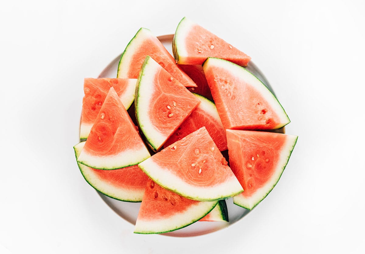 Watermelon slices on a plate on a white background