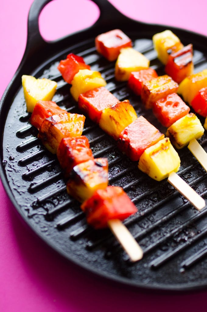 These Watermelon and Pineapple Grilled Fruit Skewers have just 4 ingredients and are dipped in a simple yogurt sauce. Throw them on the BBQ for a quick and healthy dessert this summer!