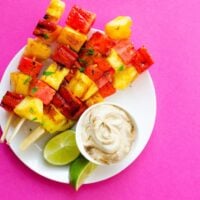 These Watermelon and Pineapple Grilled Fruit Skewers have just 4 ingredients and are dipped in a simple yogurt sauce. Throw them on the BBQ for a quick and healthy dessert this summer!