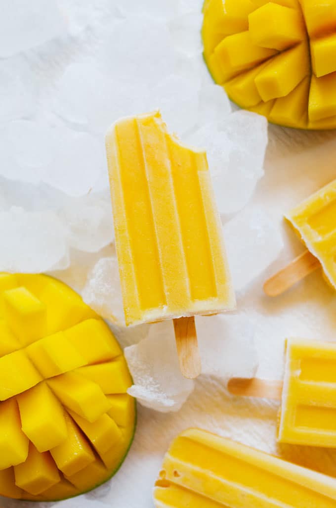 These Mango Lassi Popsicles have it all...the sweet mango, the soft texture, the...kefir? Packed with probiotics and ultra-creamy, kefir is the secret to these refreshing summer pops.