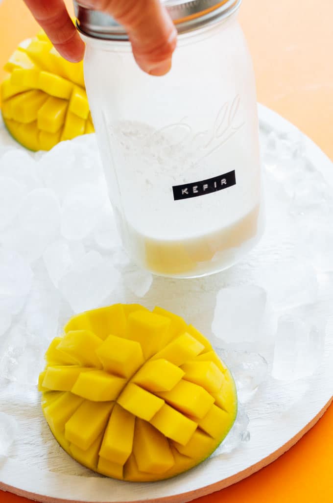 These Mango Lassi Popsicles have it all...the sweet mango, the soft texture, the...kefir? Packed with probiotics and ultra-creamy, kefir is the secret to these refreshing summer pops.