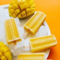 These Mango Lassi Popsicles have it all...the sweet mango, the soft texture, the...kefir? Packed with probiotics and ultra-creamy, kefir is the secret to these refreshing summer pops.