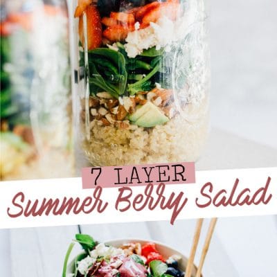 Layered salad in a mason jar with a white marble background - This 7-Layer Summer Berry Salad Jar is a filling and flavorful meal to-go that will get you excited for lunchtime!