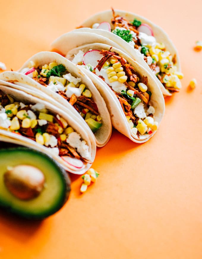 These vegetarian tacos are loaded with adobo-spiced pulled mushrooms (which have the same texture and taste as pulled pork) and a fresh corn ceviche that adds sweet crunch. Best vegetarian taco recipe of all time? Quite possibly.