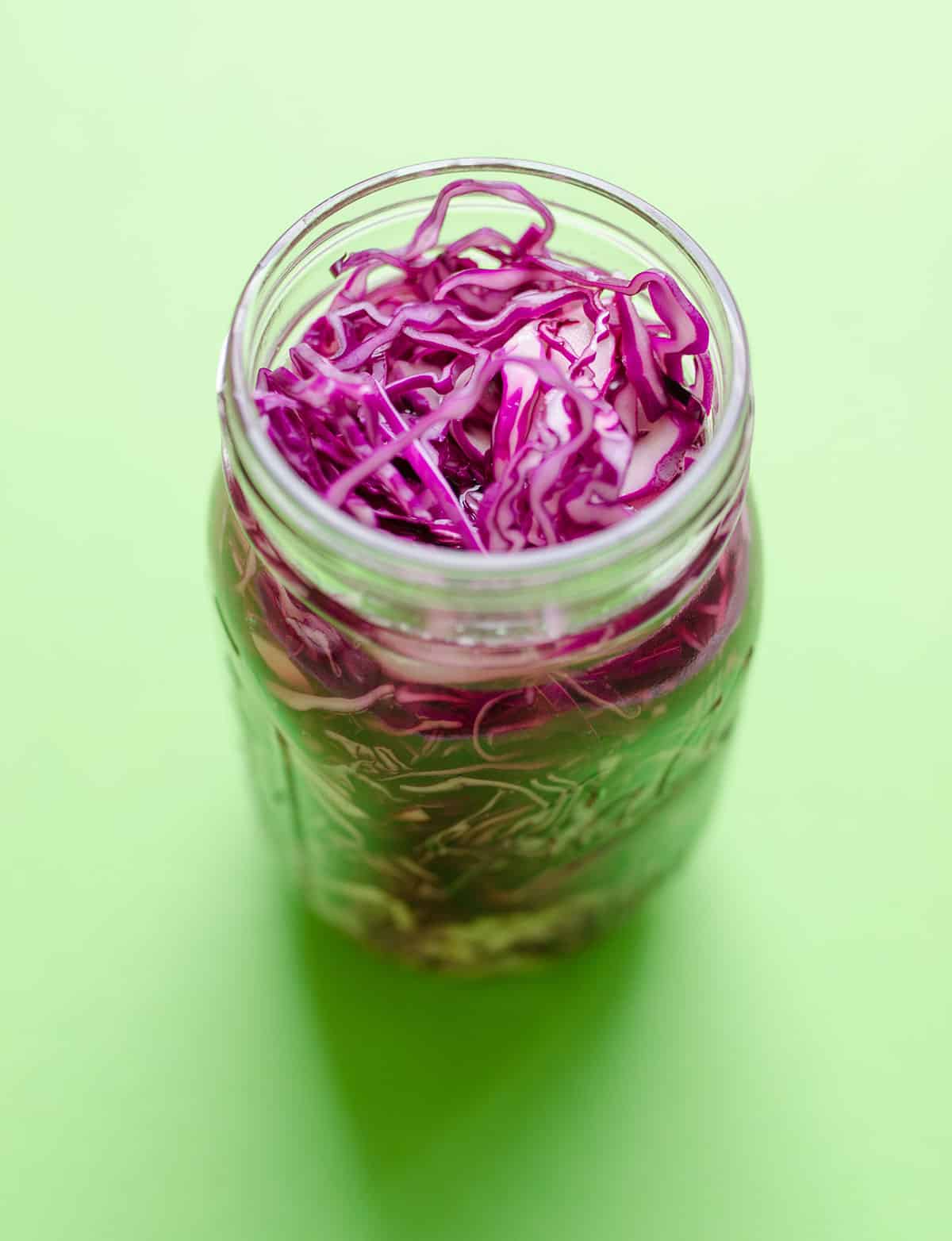 Shredded red cabbage in a jar.