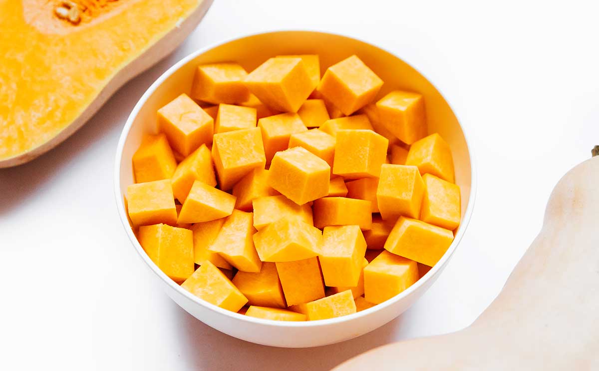Cubed butternut squash on a white background