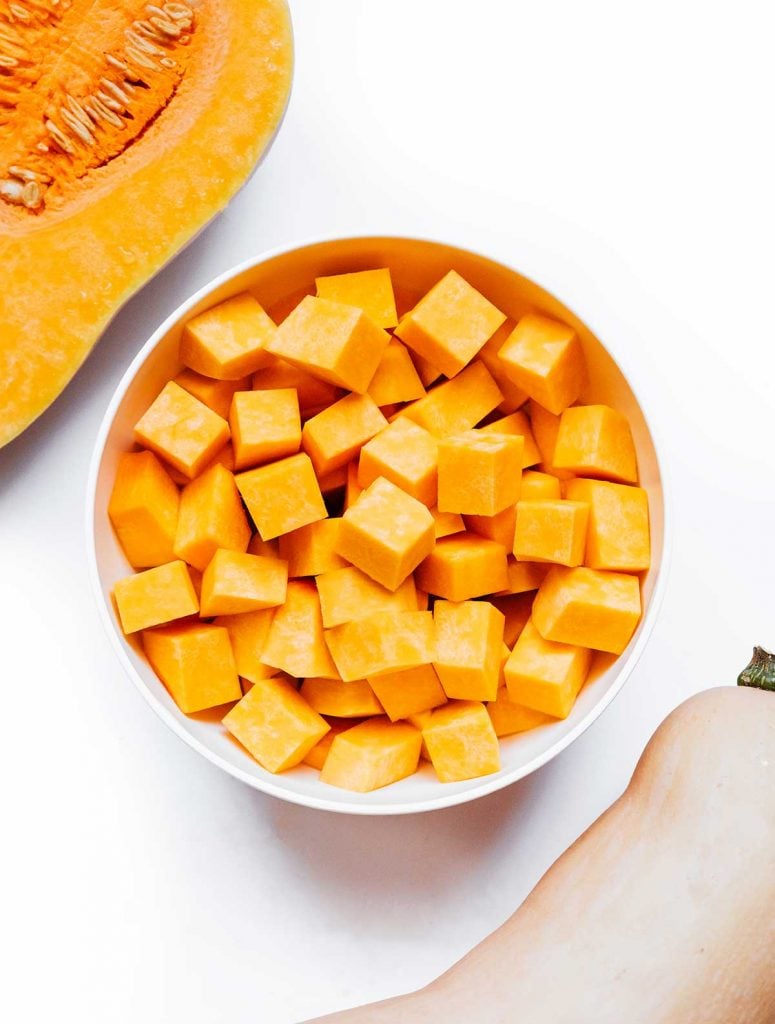 Cubed butternut squash on a white background
