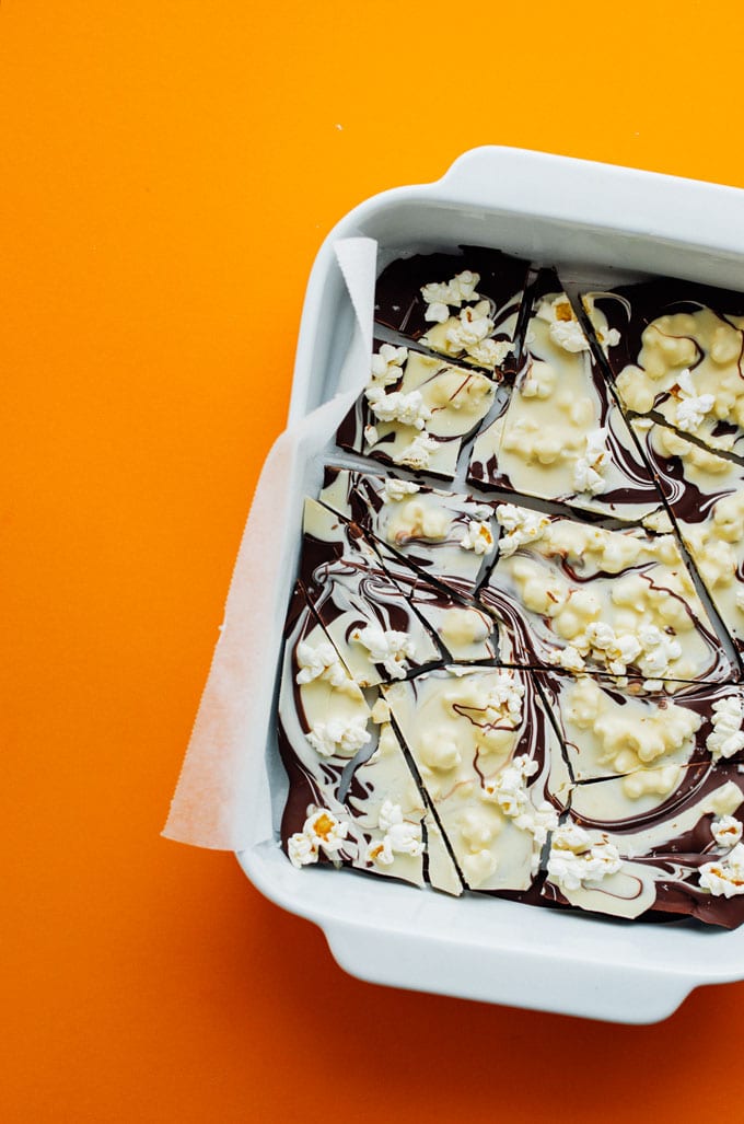 Dark and white chocolate bark in a pan on an orange background